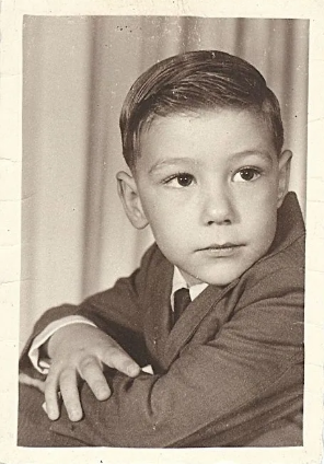 Mike as a young boy, black and white portrait