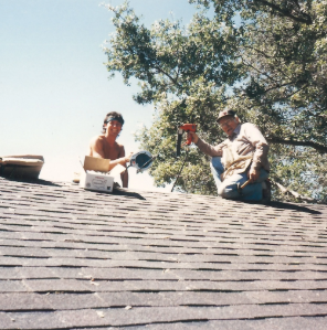 Mike and a friend working together on a roof