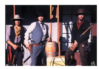 Mike with fellow performers in western gunfighter costumes