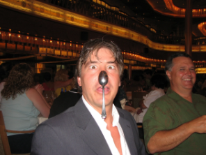 Mike balancing a spoon on his nose at a restaurant