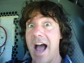 Mike with wild eyes making a face