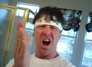 Mike yelling with a headband on